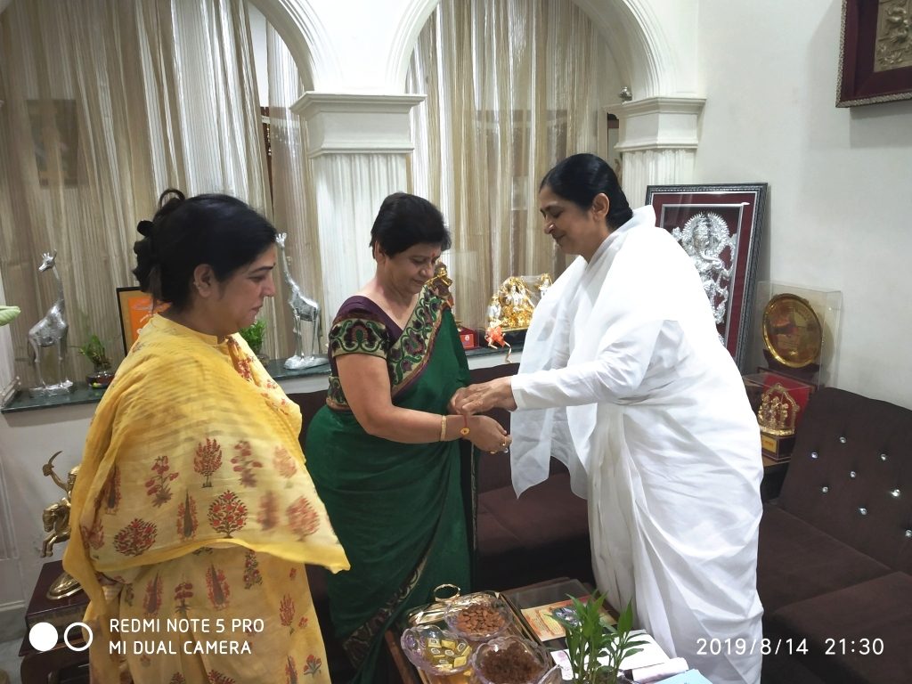 Hon'ble Mayor of Lucknow Smt. Sanyukta Bhatia Bahen and BK Radha Bahen tying Rakhi to each others