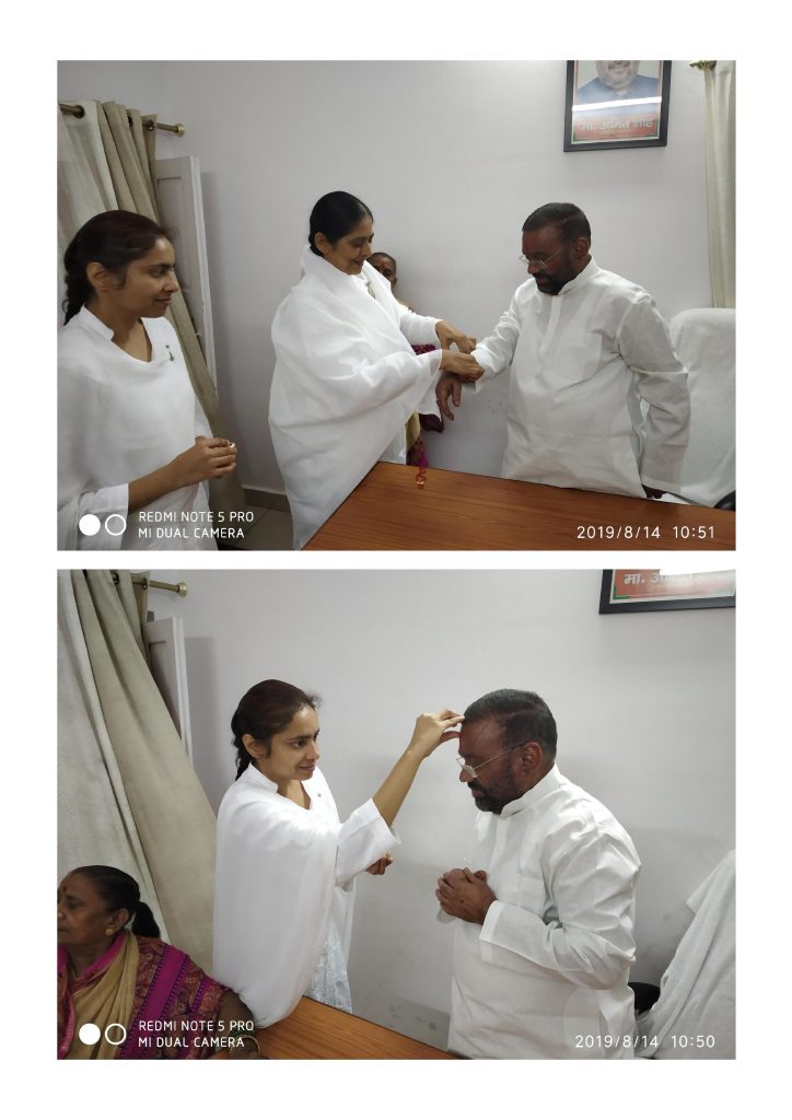 BK Radha Didi Ji tying Rakhi to Hon'ble Energy Minister of UP Brother Sri Srikant Sharma Ji